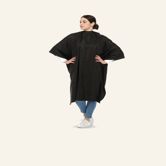 Friseurumhang Schwarz Wasserabweisend Polyester - Produktfoto auf beigem Hintergrund