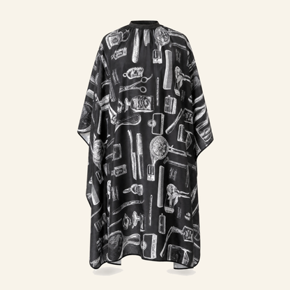 Friseurumhang New York Schwarz-Weiß Polyester - Produktfoto auf beigem Hintergrund