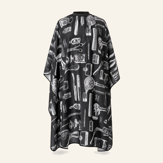 Friseurumhang New York Schwarz-Weiß Polyester - Produktfoto auf beigem Hintergrund