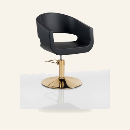 Profi Friseursessel Gold Eco-Leder Schwarz - Produktfoto auf beigem Hintergrund